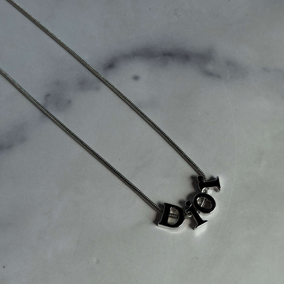 Christian Dior Silver Tone Spell Out Necklace - Queen May