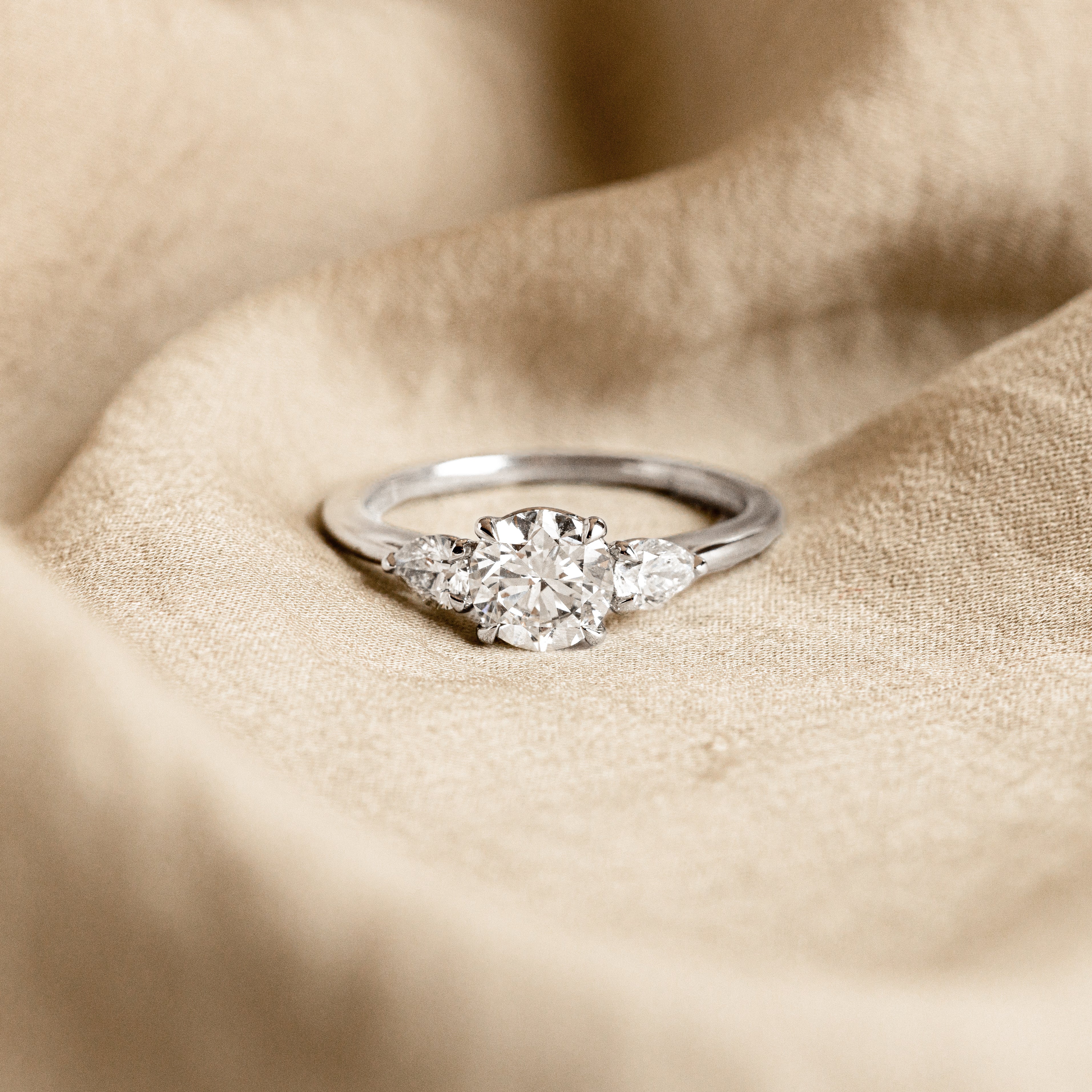 1.04 Carat Round Brilliant Diamond Three Stone Pear Accent Engagement Ring in Platinum - Queen May