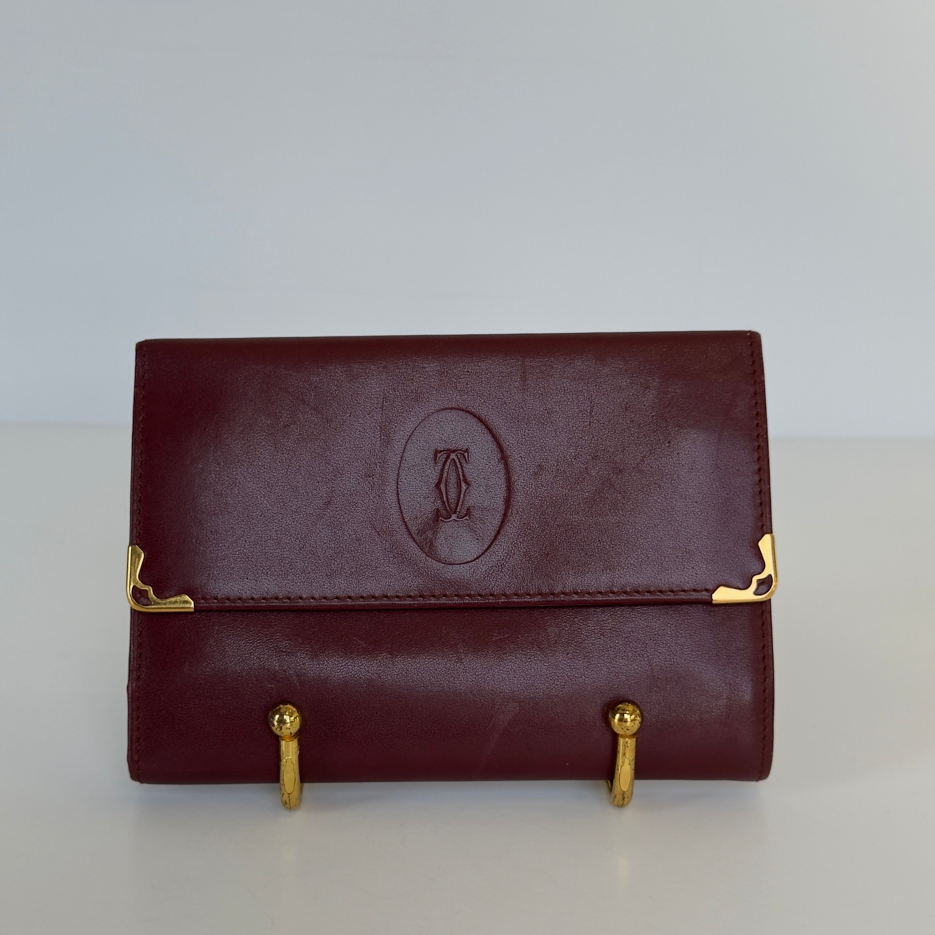 Cartier Paris Logo Kiss Lock Burgundy Tri Fold Wallet - Queen May