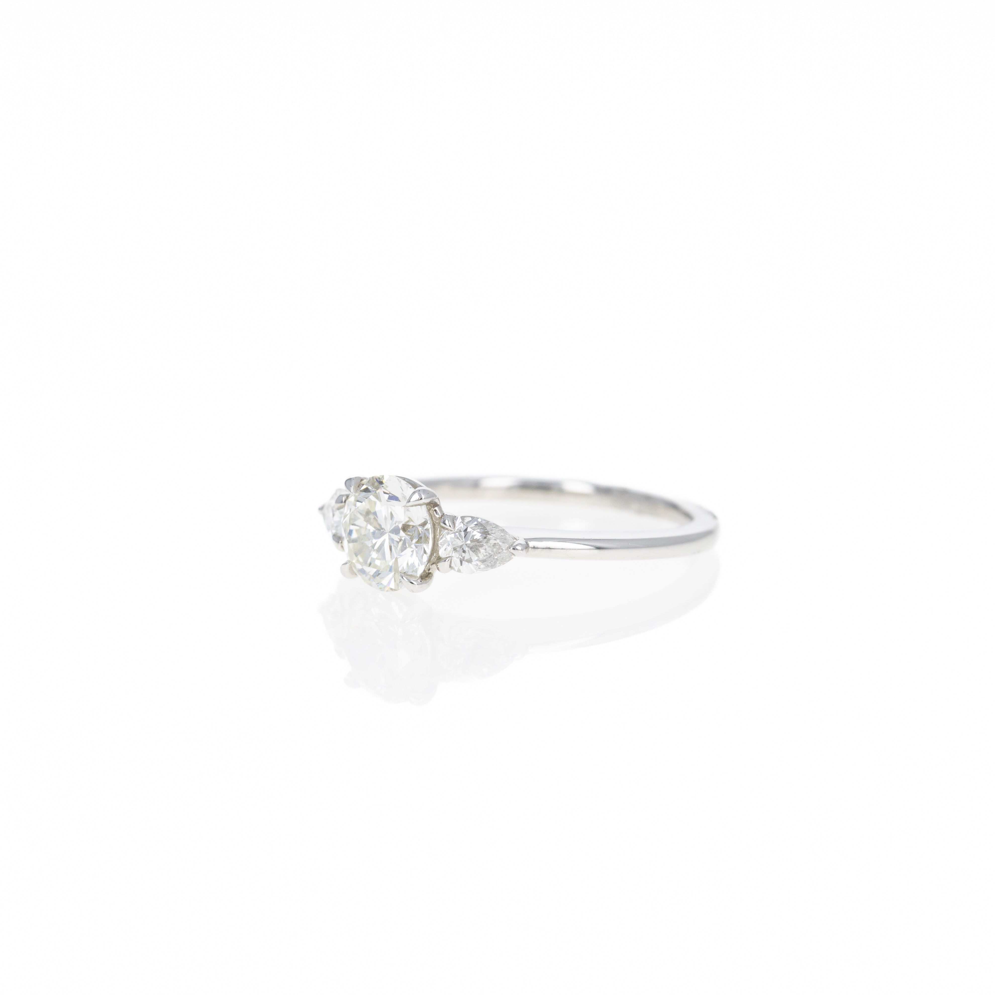 1.04 Carat Round Brilliant Diamond Three Stone Pear Accent Engagement Ring in Platinum - Queen May