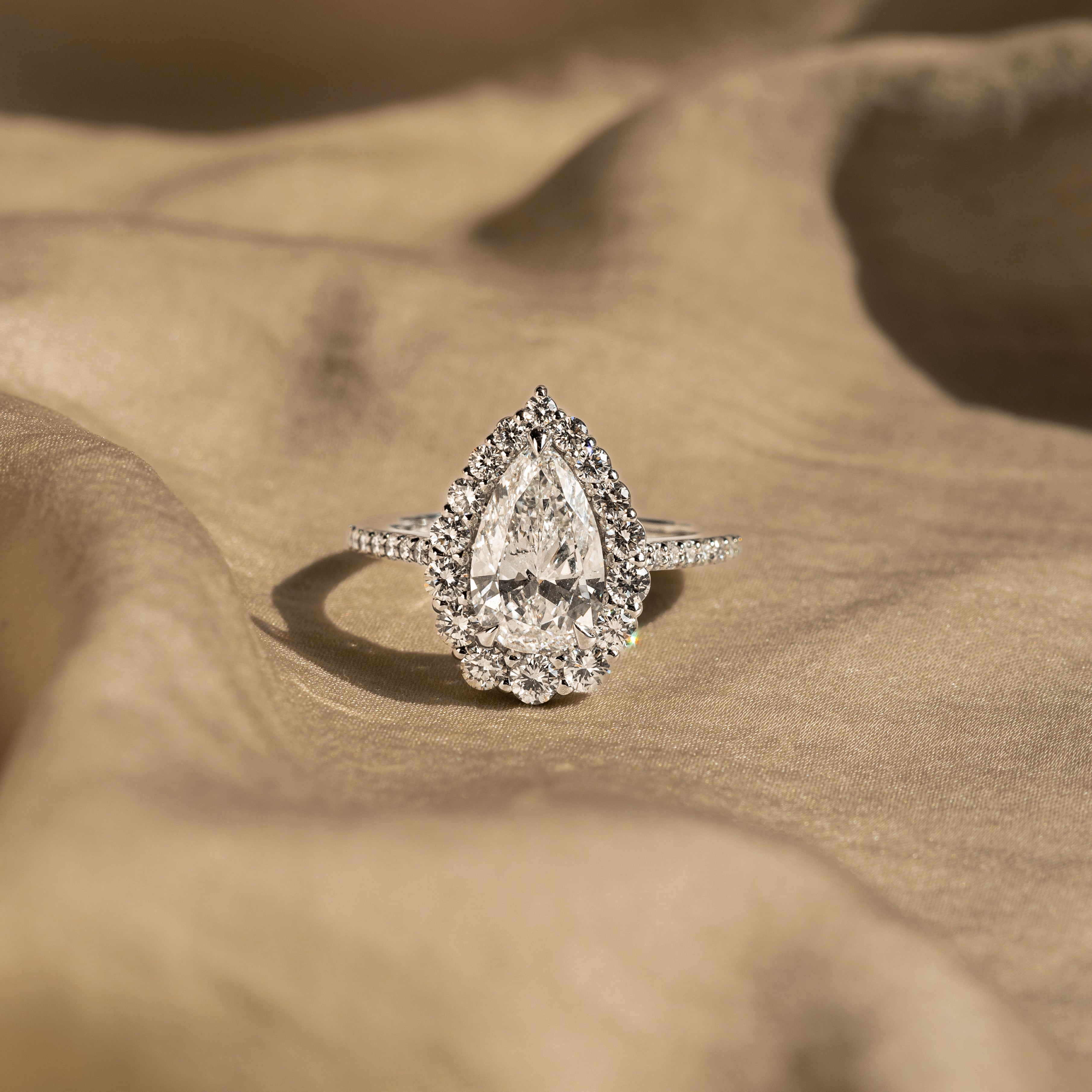 2.24 Carat Pear Diamond Graduated Halo Engagement Ring - Queen May