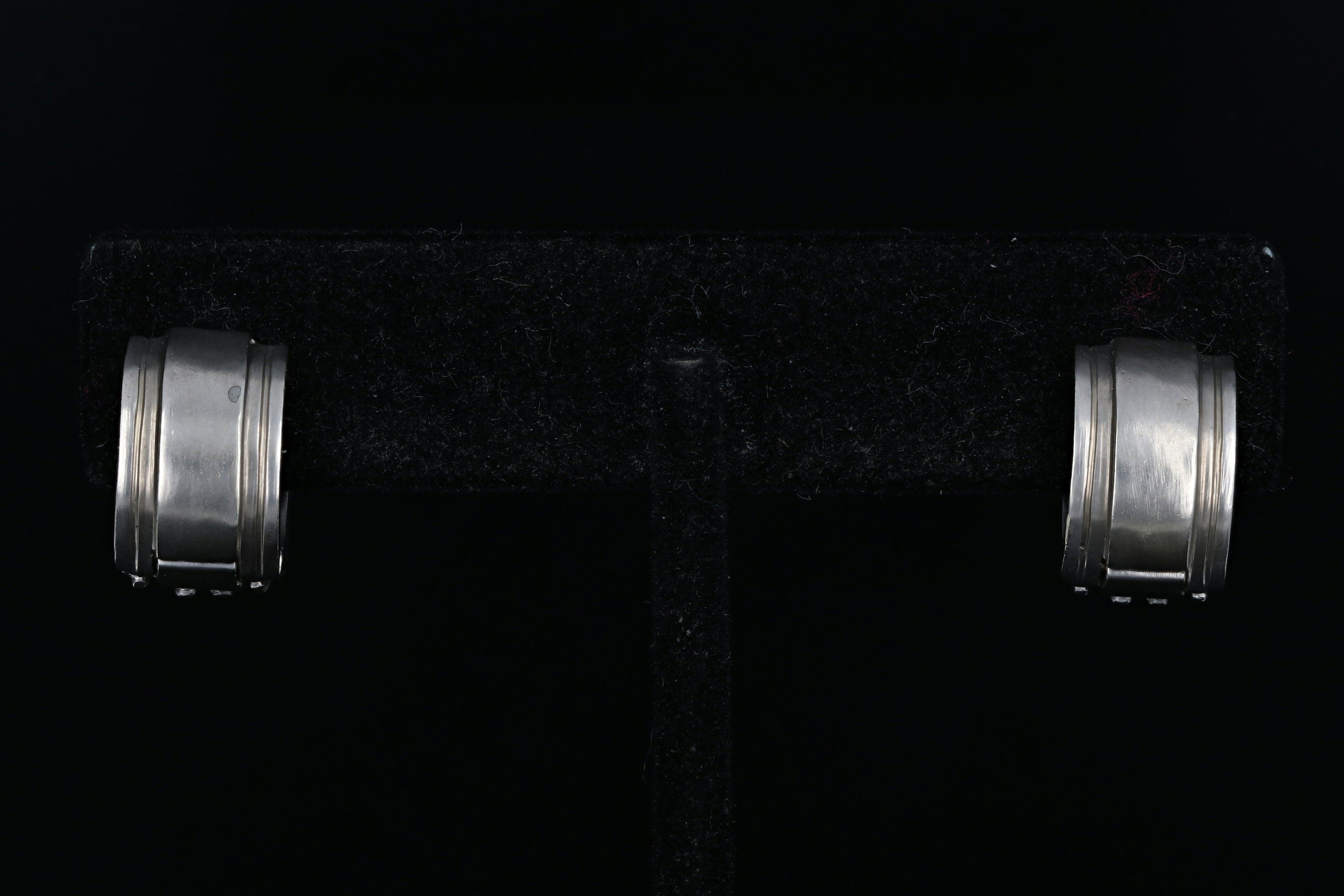 14K White Gold .20 CTW Diamond Huggie Hoops - Queen May