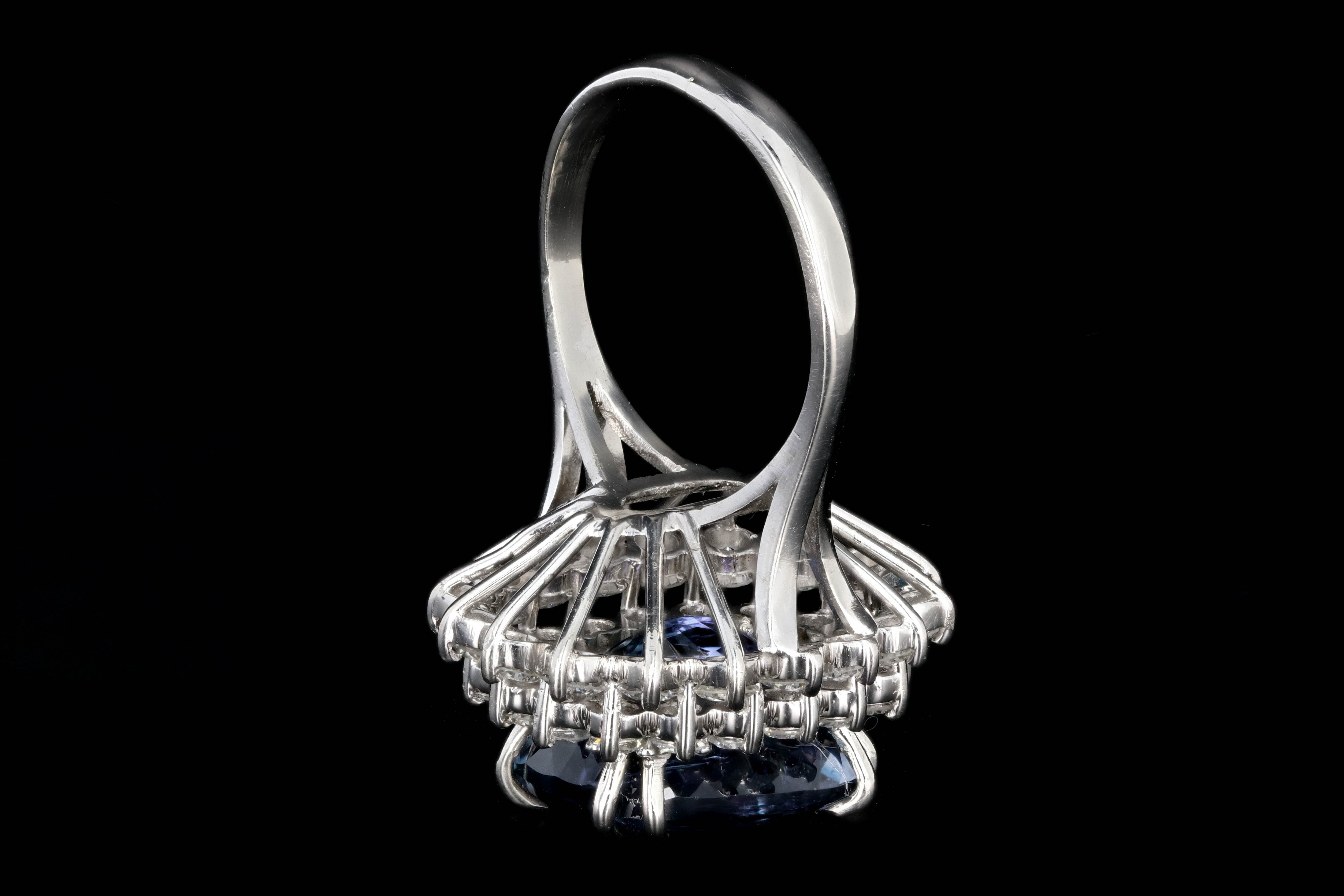 Modern Platinum 9.51 Tanzanite and Diamond Halo Ring - Queen May
