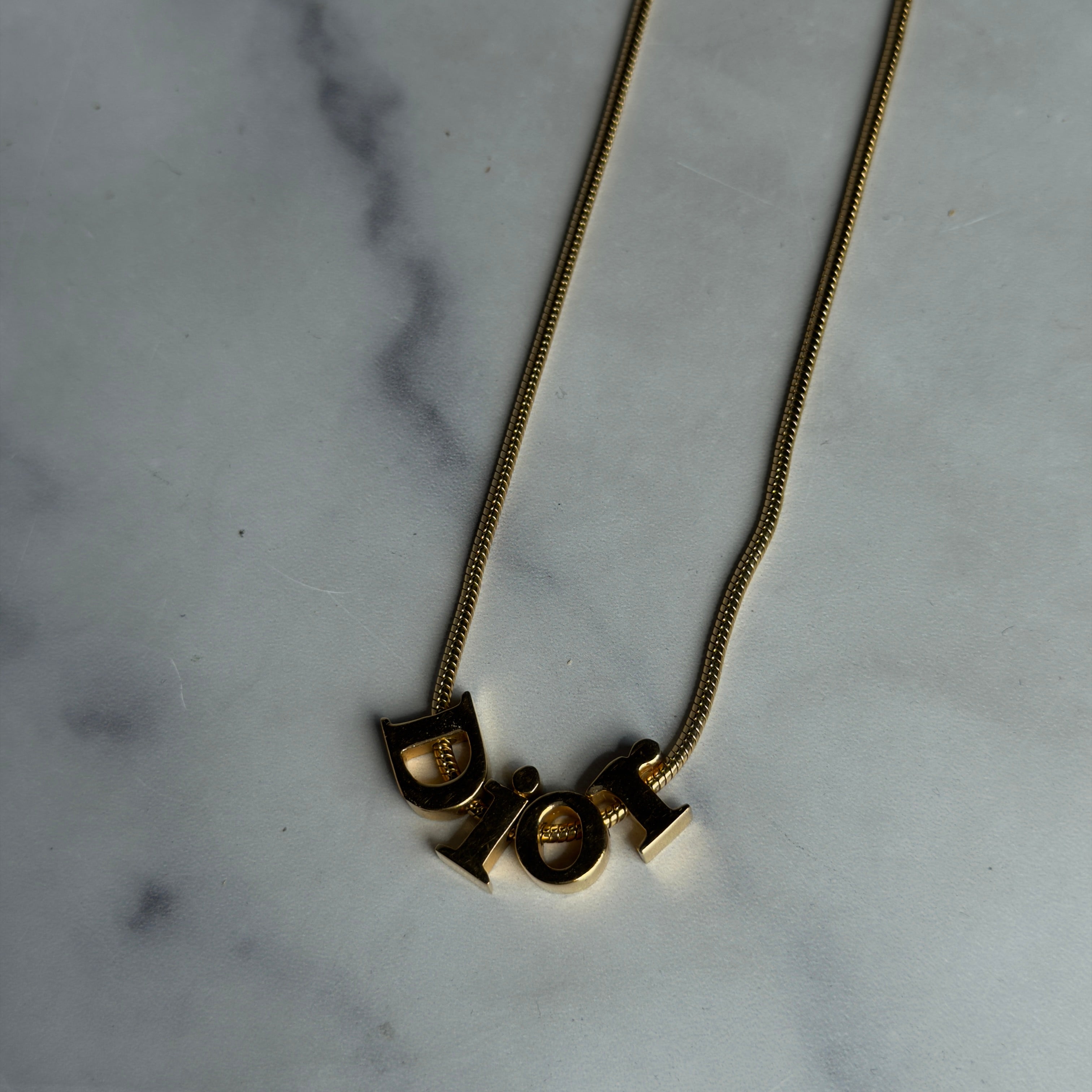 Christian Dior Gold Tone Spell Out Necklace