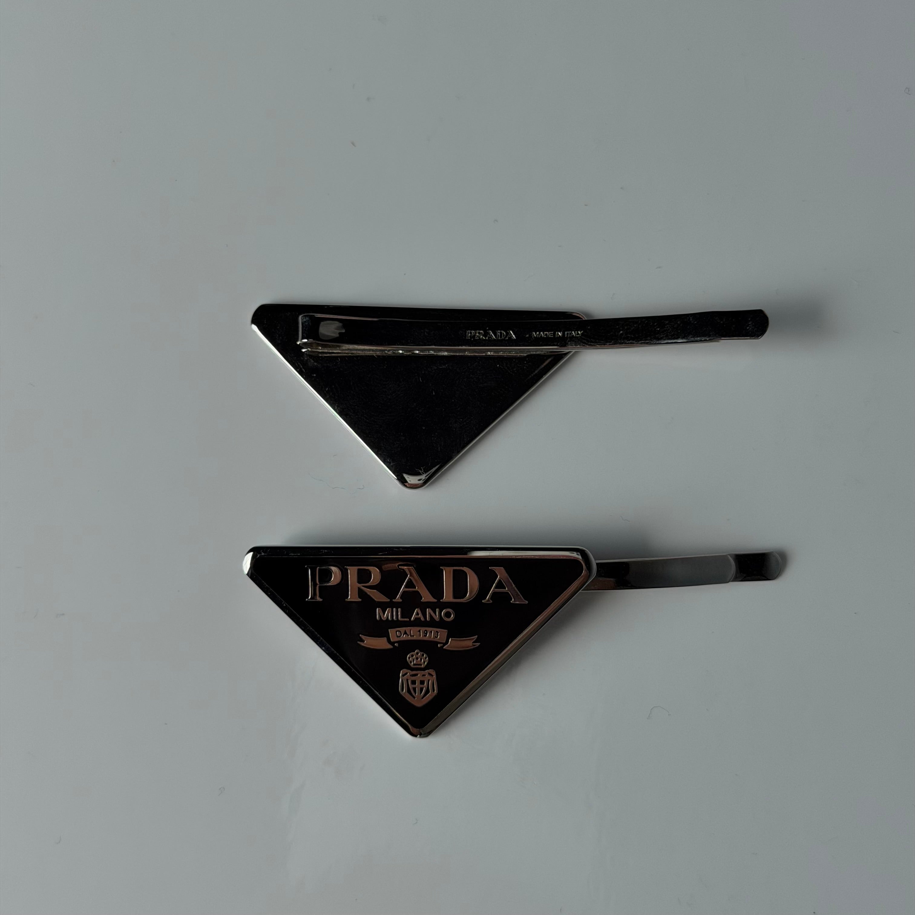 Prada Enamel Triangle Logo Hair Clips