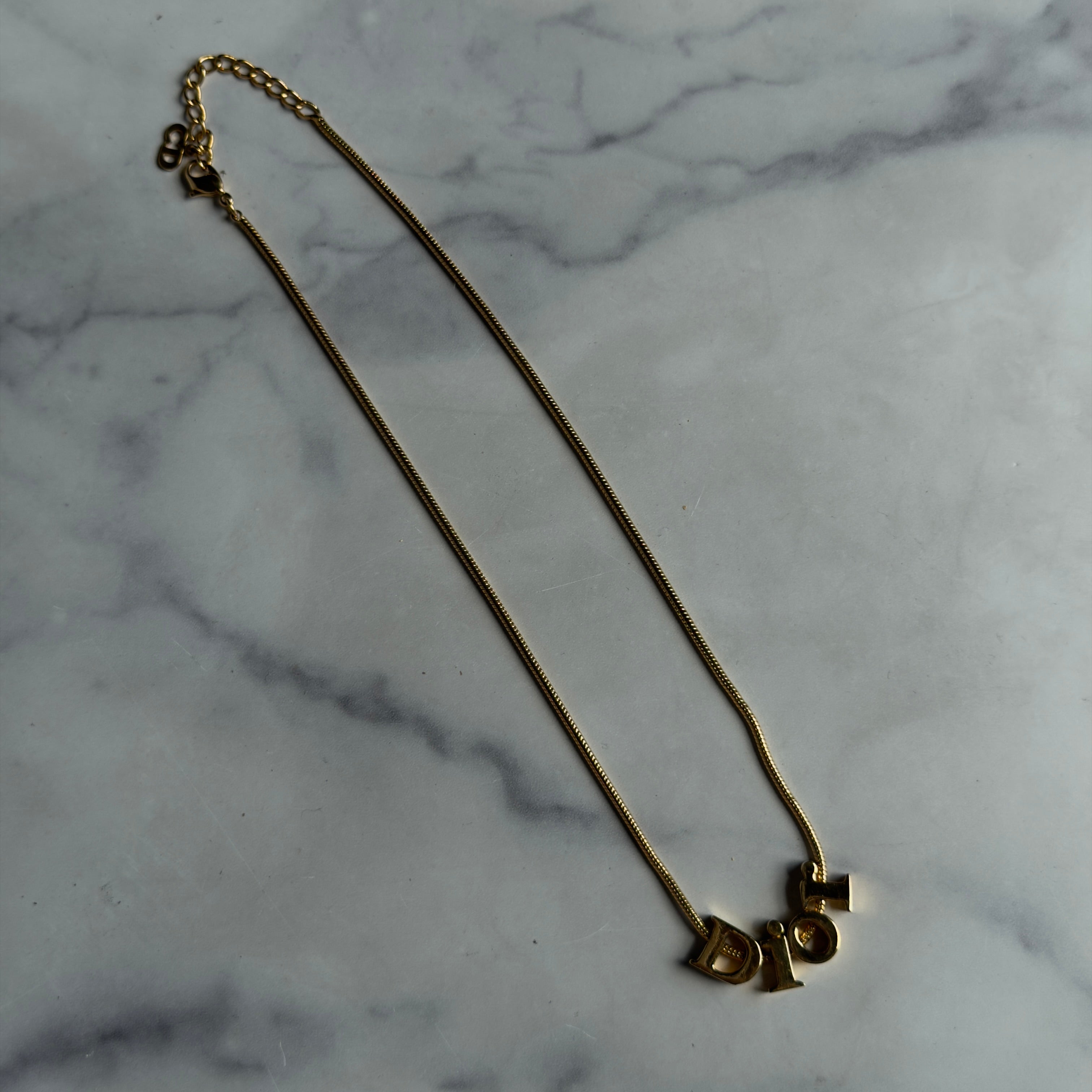 Christian Dior Gold Tone Spell Out Necklace