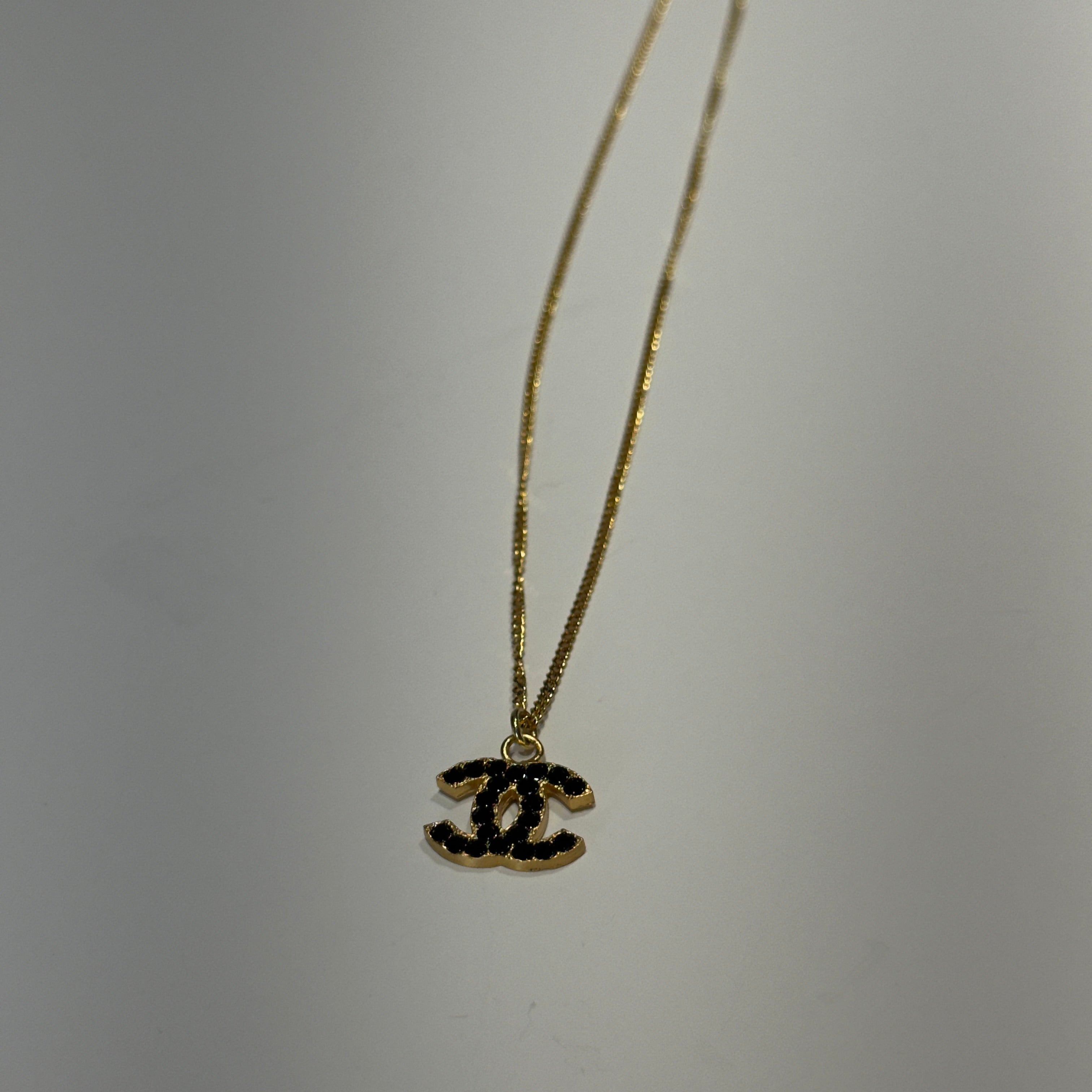 Chanel 2001 A Gold Tone Black Rhinestone CC Necklace - Queen May