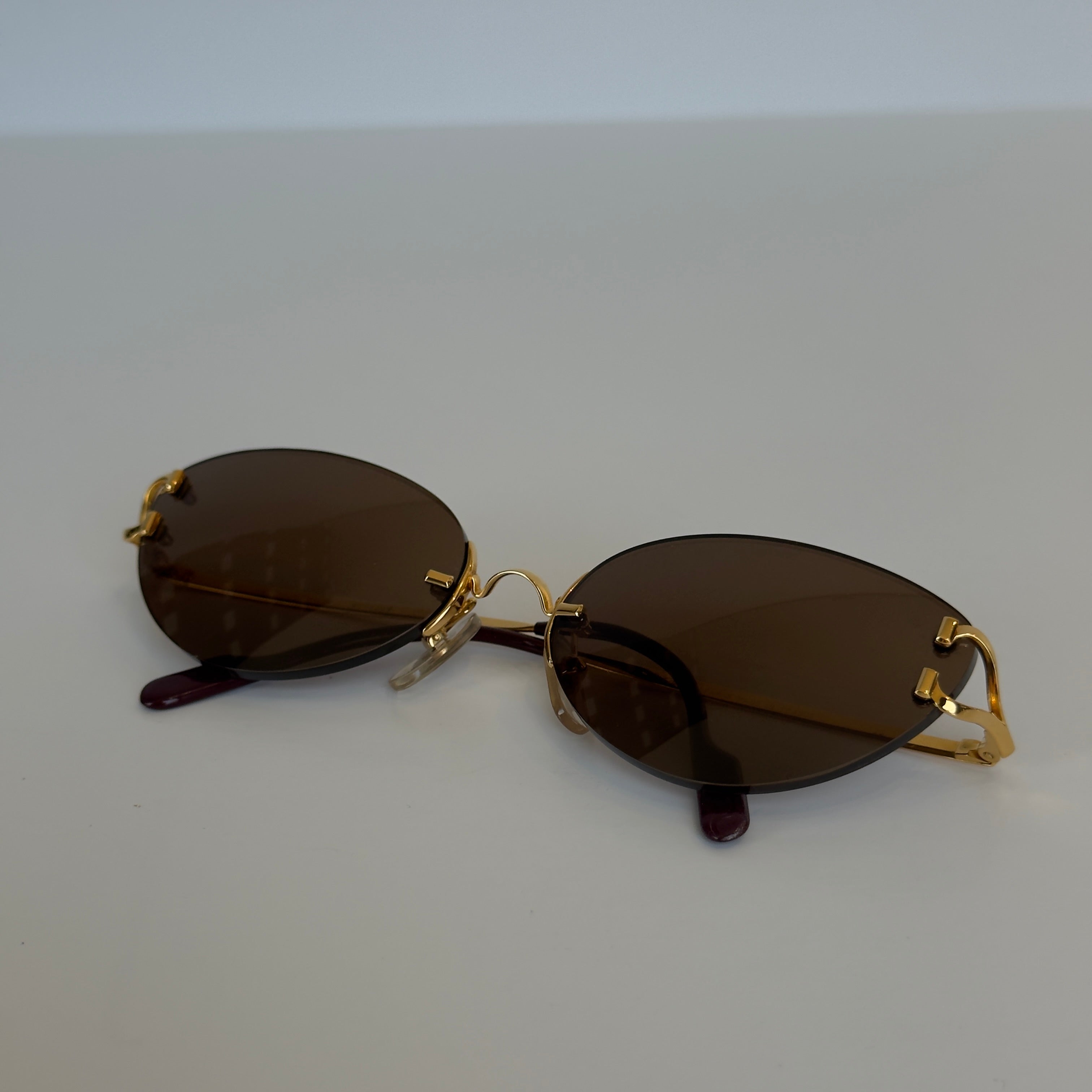 Cartier Oval Rimless Sunglasses Brown - Queen May