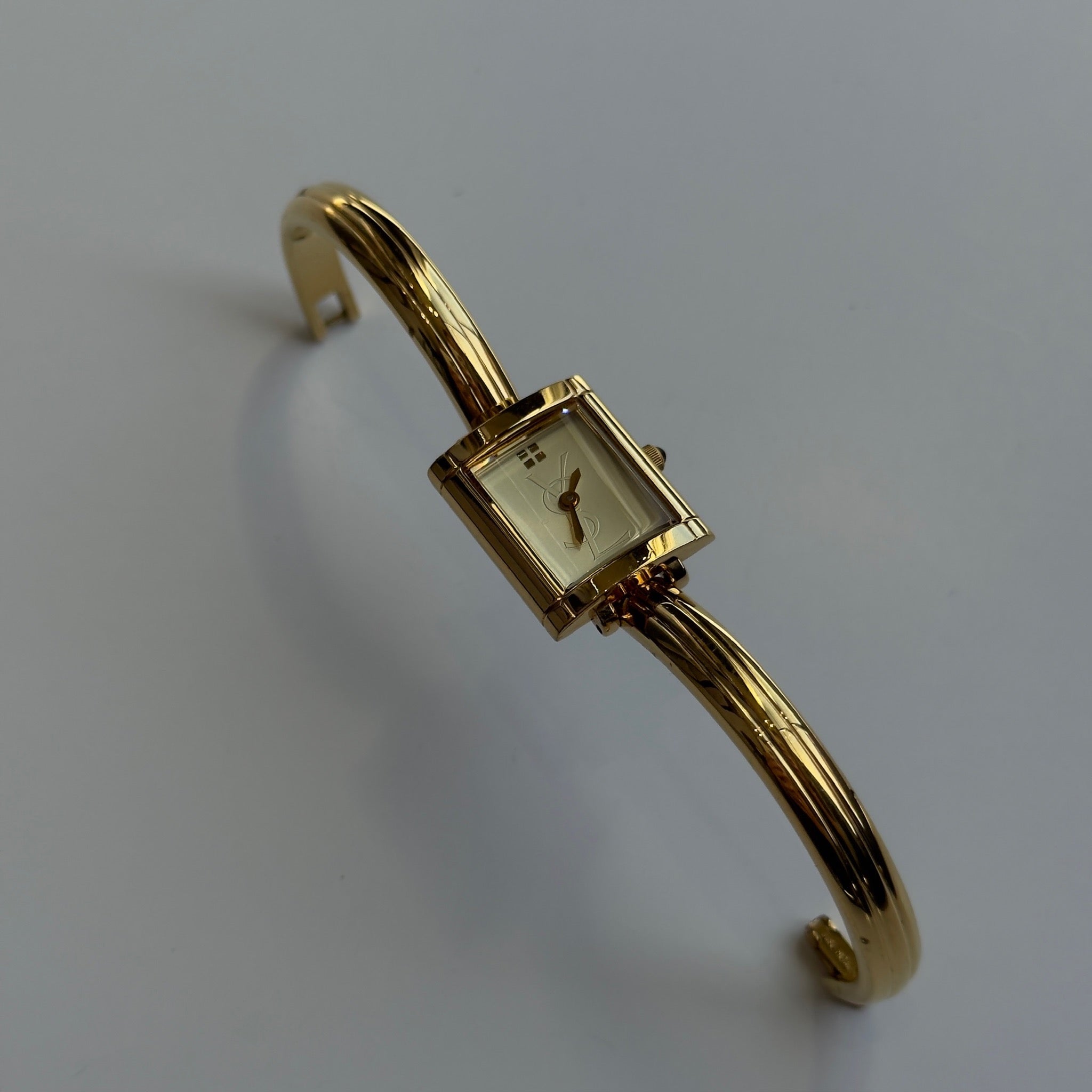 Yves Saint Laurent Champagne Logo Dial Watch - Queen May