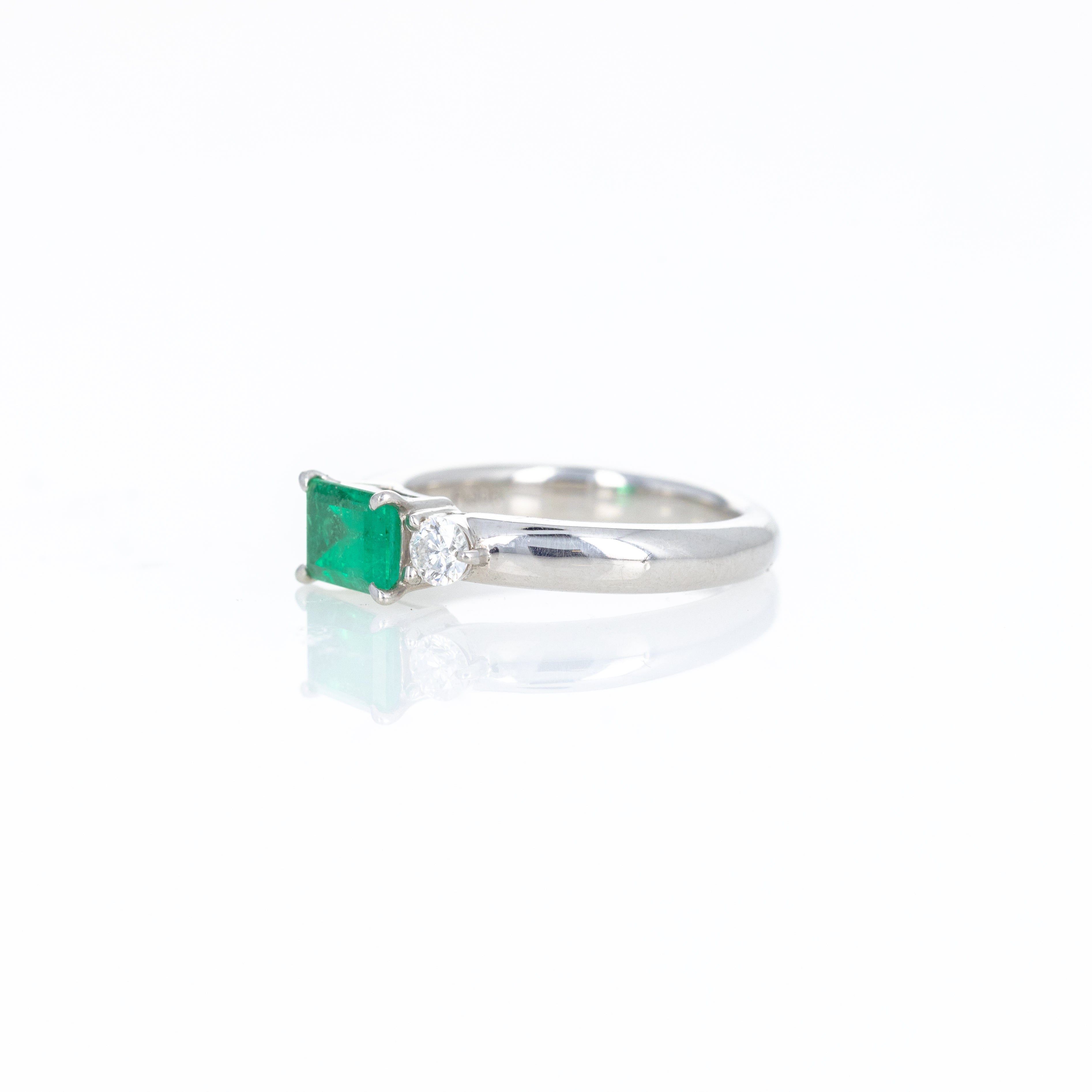 Platinum 0.71 Carat Emerald Diamond Three Stone Ring - Queen May