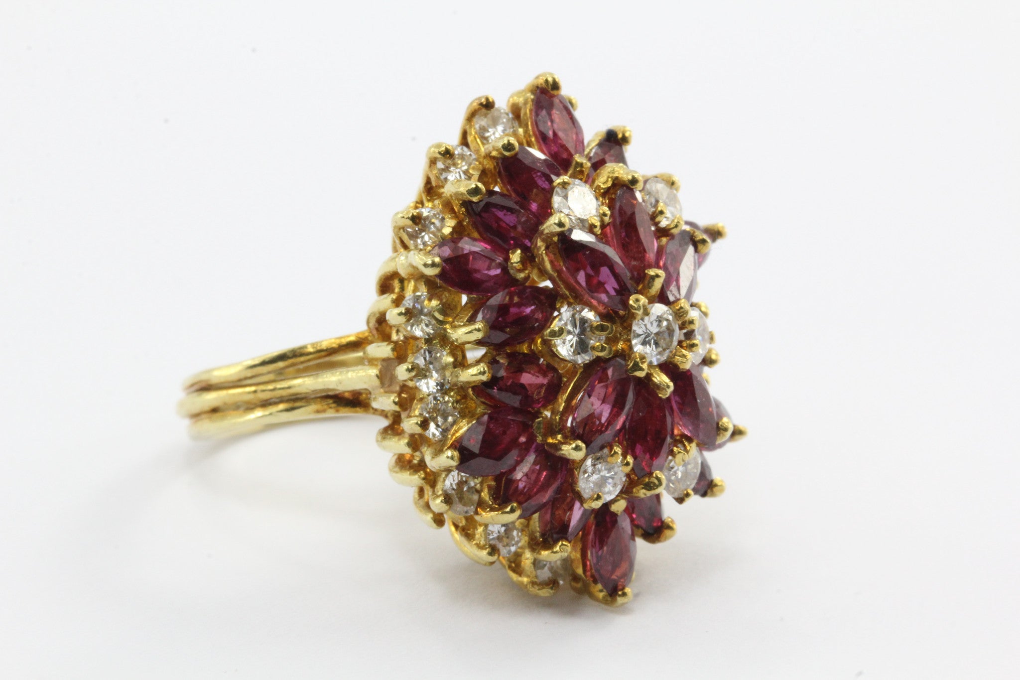 An 18k natural ruby and diamond cocktail ring featuring 5 carats of rubies and 1 carat of diamonds. - Queen May