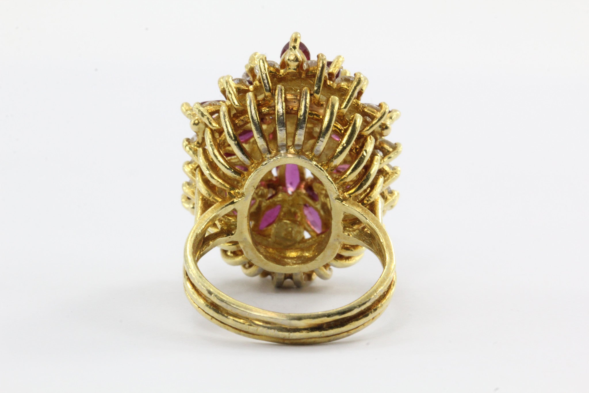An 18k natural ruby and diamond cocktail ring featuring 5 carats of rubies and 1 carat of diamonds. - Queen May