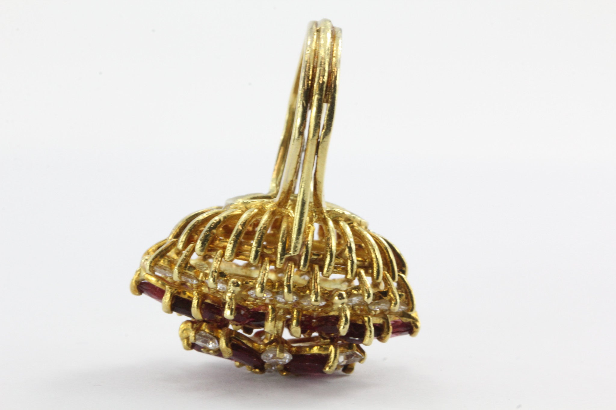 An 18k natural ruby and diamond cocktail ring featuring 5 carats of rubies and 1 carat of diamonds. - Queen May